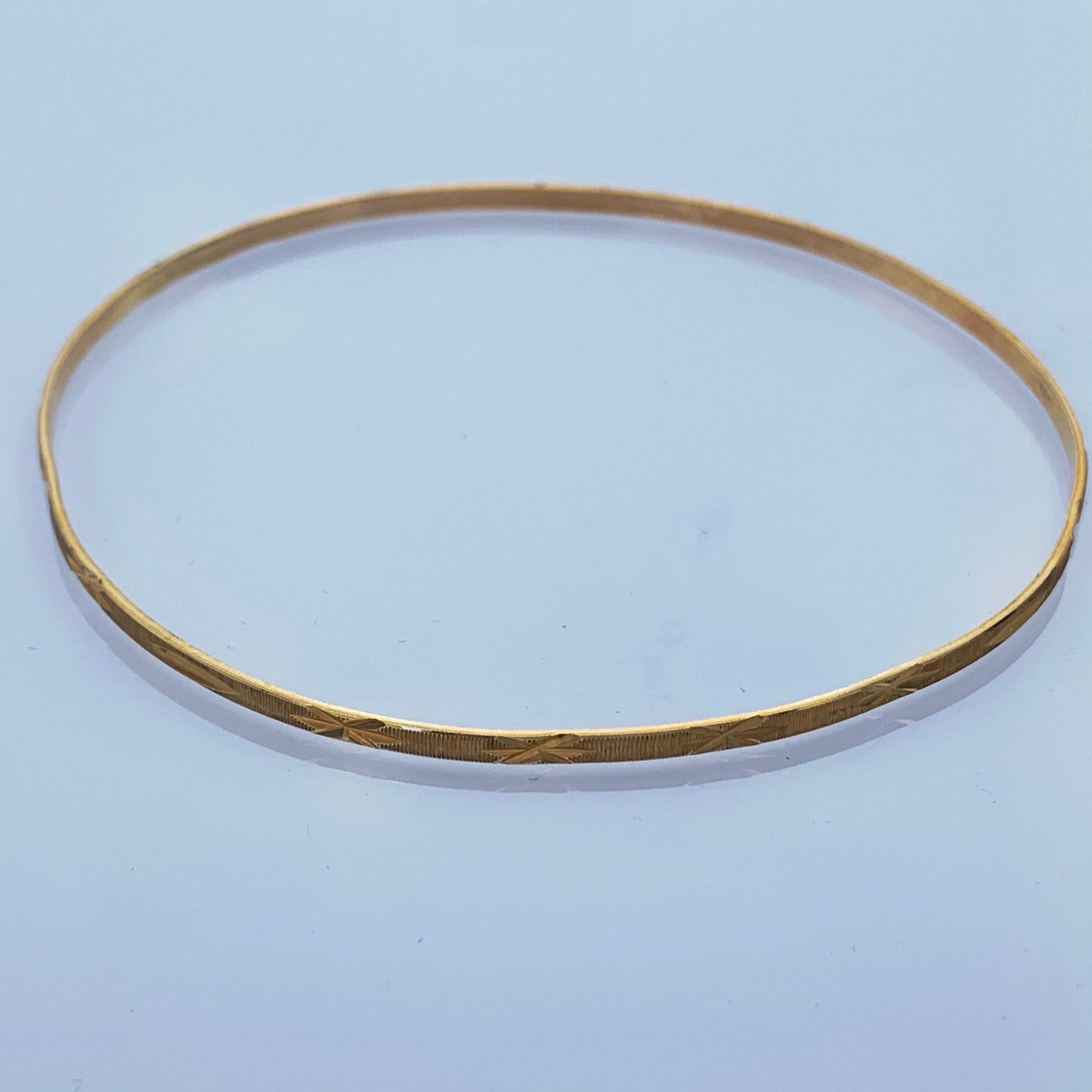 10K Yellow Gold 2mm Bangle Bracelet with Star Design
