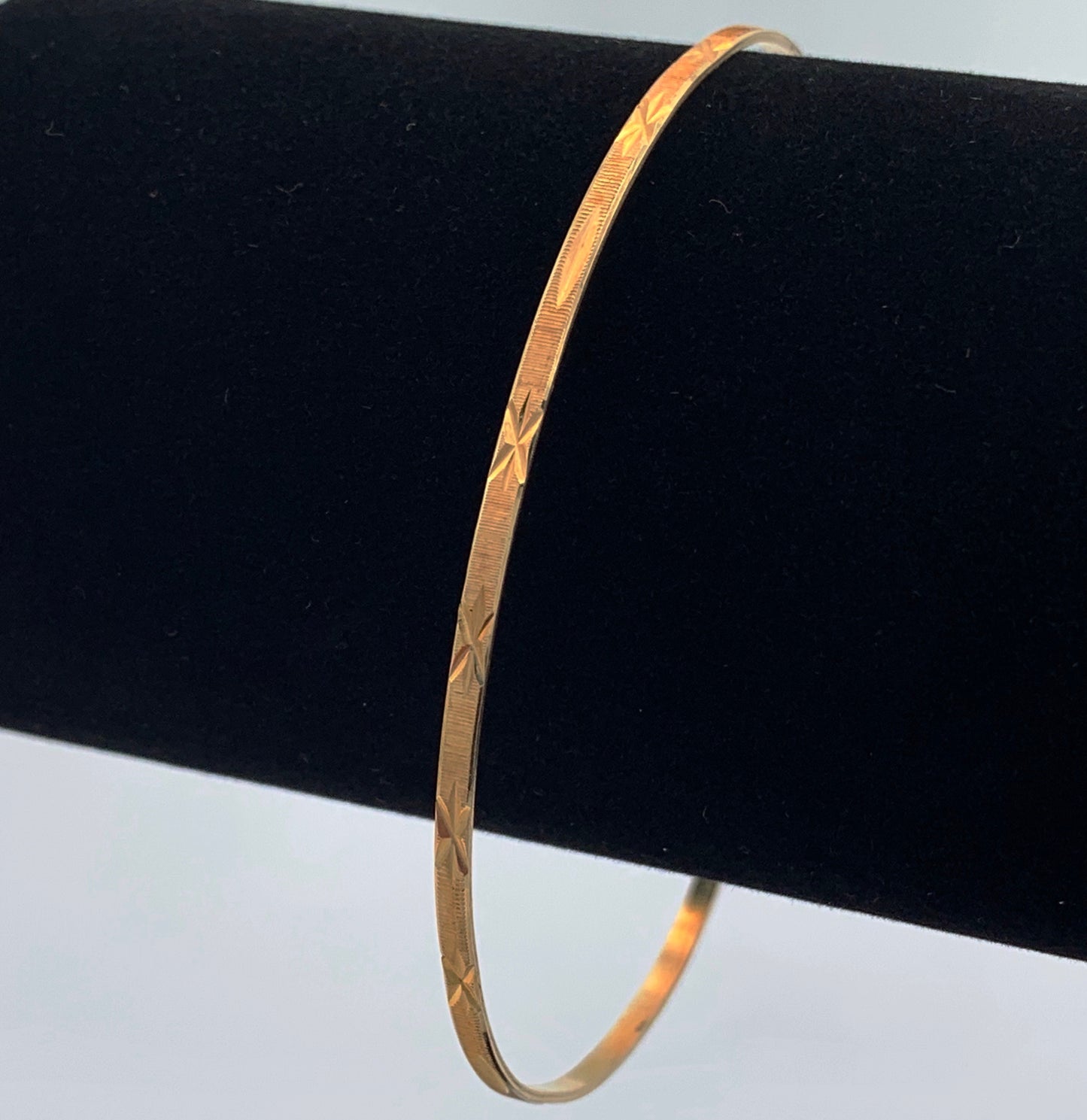 10K Yellow Gold 2mm Bangle Bracelet with Star Design